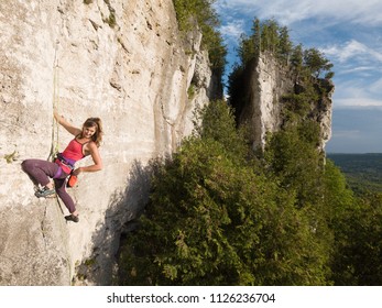 Beautiful Woman Rock Climbing In Ontario, Canada.