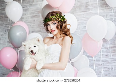 Beautiful woman with a Samoyed dog