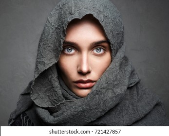 beautiful woman in scarf.fashionable arabian style girl.beauty portrait.beautiful eyes