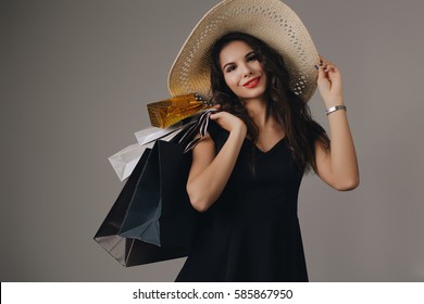 Beautiful Woman With Shopping Bags. Studio Shoot