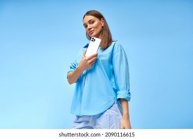 Beautiful Woman Showing Mobile Phone. Innovation Telephony Concept