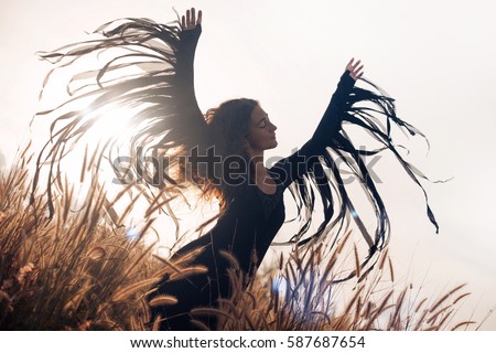 beautiful woman silhouette. wings and freedom concept