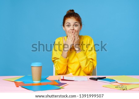 Beautiful woman sitting at the table work morning morning coffee background