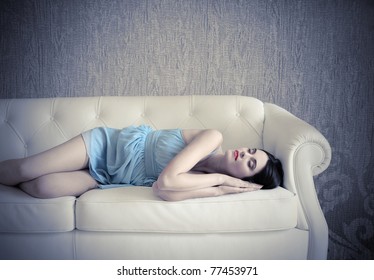 Beautiful Woman Sleeping On A Sofa