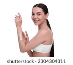 Beautiful woman with smear of body cream on her arm against white background
