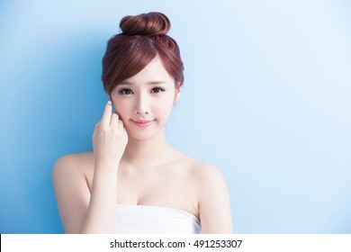 beautiful woman smiles. isolated on blue background, asian