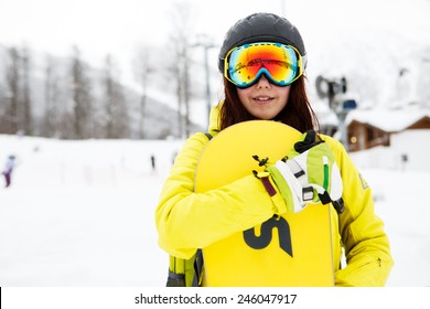 Beautiful Woman With A Snowboard