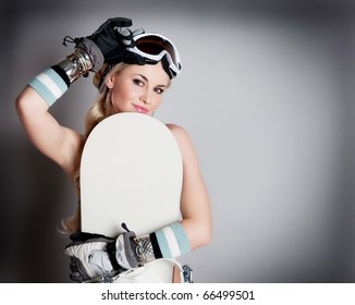 Beautiful Woman With A Snowboard In Studio