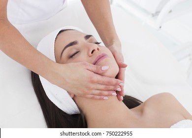 Beautiful Woman Is Spa Having A Facial Massage.