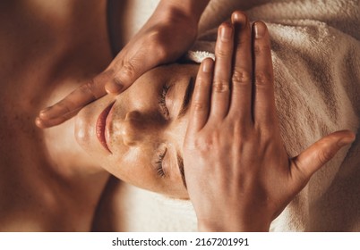 Beautiful woman in spa salon getting face massage treatment. Girl facial treatment. Skin care. Body care. - Shutterstock ID 2167201991