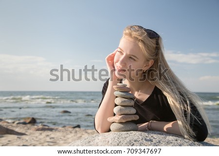 Similar – Portrait of a young woman on the beach