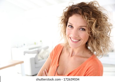 Beautiful Woman Standing In Brand New Home