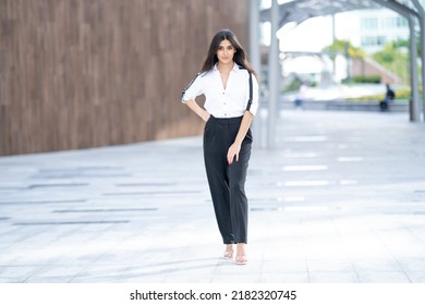 Beautiful woman standing outdoor wearing professional business formal fashion. Arab or Indian looking businesswoman posing outdoors - Powered by Shutterstock