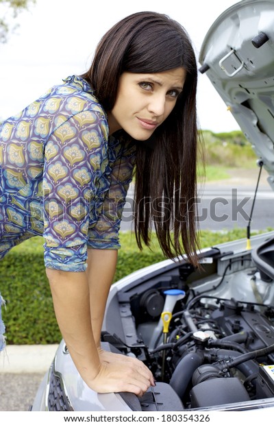 Beautiful woman\
stressed out for broken\
engine