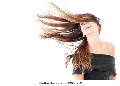 Beautiful Woman In Studio Shot With Wind On Hair .