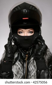 Beautiful Woman With Stylish Makeup In Black Biker Helmet, Mask And Gloves
