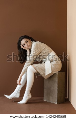 Similar – Woman in work wear in her workshop by table with handmade items