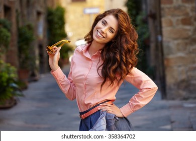 Beautiful Woman In Summer Dress Walking And Running Joyful And Cheerful Smiling In Tuscany, Italy. 