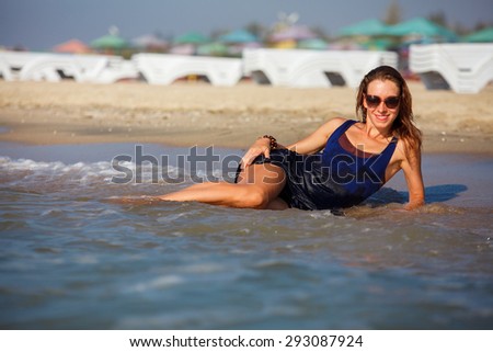 Beautiful woman sunbathing at the seaside