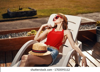 Beautiful Woman In Sunbed Relaxing Tan Sun Nature