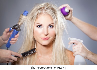 Beautiful Woman Surrounded By Hair Care Tools