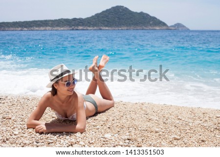 beautiful woman swim wear at the beach in sunny summer