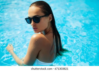 Beautiful Woman In A Swimming Pool 