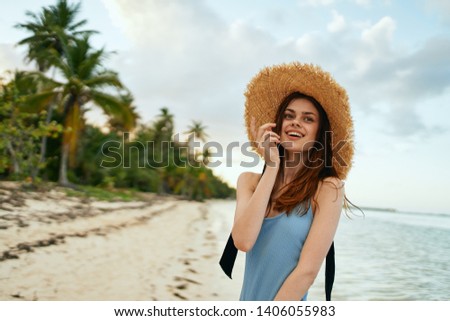    beautiful woman in swimsuit hat nature ocean                            