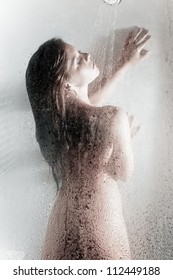 Beautiful Woman Taking A Hot Shower Focus On Glass