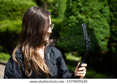 Similar – Attractive young woman with a rifle at the ready aims at her target and has her finger on the trigger