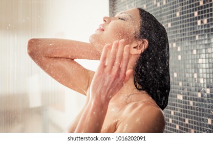 Beautiful woman taking shower in her bathroom