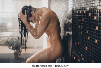Beautiful woman taking shower in her bathroom