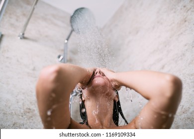 Beautiful woman taking shower in her bathroom.