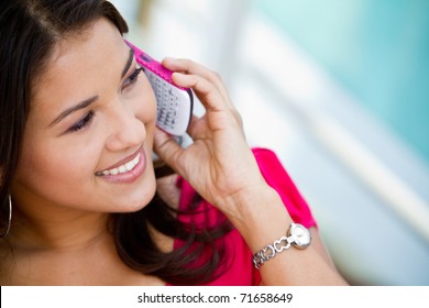 Beautiful woman talking on her cell phone