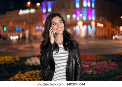 Beautiful Woman Talking On Mobile Phone, Walking In Night City