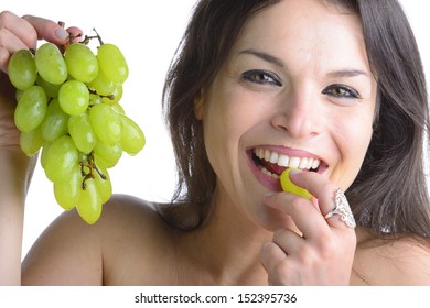 beautiful woman tasting grapes