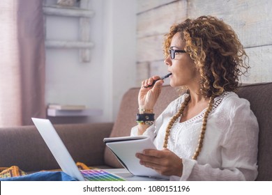 Beautiful Woman Think And Write Notes On Paper Working On A Laptop Freedom From Office At Home. Alternative Lifestyle And Place To Work On. Nice Life Daily Scene - Smart Working Lifestyle