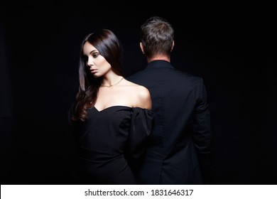 beautiful woman together with a man in a suit. Relationship concept photo. treason