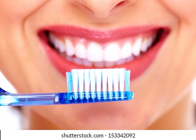 Beautiful Woman With Toothbrush. Dental Care Background.