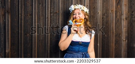 Beautiful woman in a traditional bavarian dirndl Oktoberfest