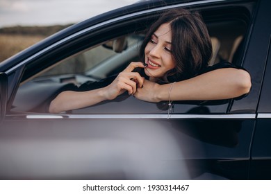 Beautiful woman traveling by car
