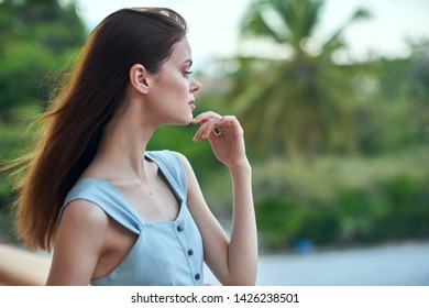 beautiful woman travels in nature in a blue sundress and red hair                              - Shutterstock ID 1426238501