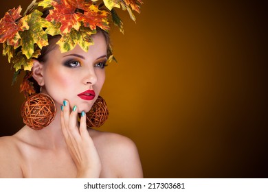 Beautiful Woman With Tree Autumn Ornament In Head. Studio. Beauty And Fashion. Young Woman Portrait With Autmn Tree Concept