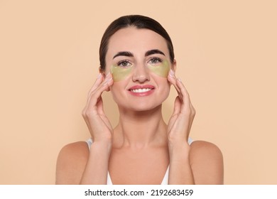 Beautiful Woman With Under Eye Patches On Beige Background