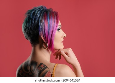 Beautiful Woman With Unusual Hair On Red Background