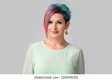 Beautiful Woman With Unusual Hair On Grey Background