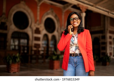 Beautiful woman using the phone. Young businesswoman typing a message. - Powered by Shutterstock