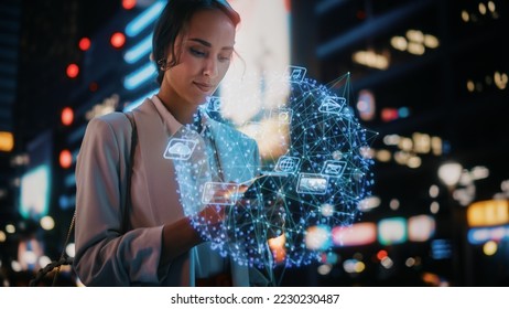 Beautiful Woman Using Smartphone on a City Street at Night. Businesswoman Using Mobile Phone, Infographics Show Productivity, Economics, e-Commerce, Finance, Statistics Graphs, Stock Market Data - Powered by Shutterstock