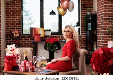 Beautiful Woman With Valentines Day Expensive Gifts In Living Room, Blonde Attractive Girlfriend With Luxury Present Boxes, Bear Soft Toy, Flowers, Balloons. February 14 Romantic Surprises