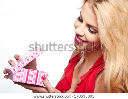 Beautiful woman with Valentine's Day gift